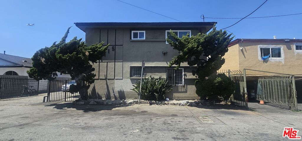 Residential Income for sale at 1115 W 111th Street, Los Angeles CA featuring 12 beds and 6 baths