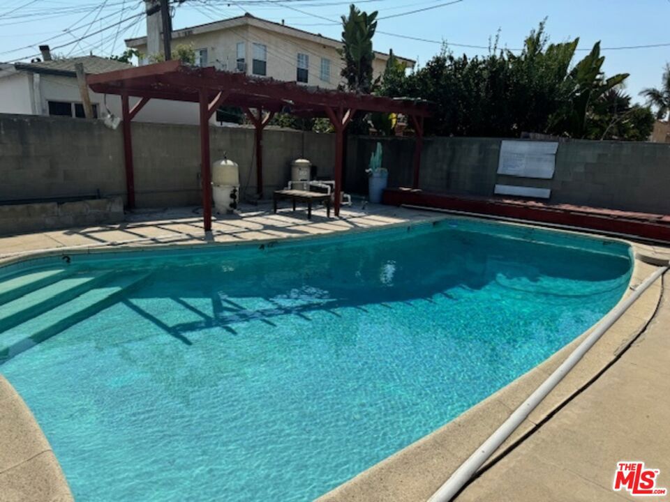 Residential Income for sale at 2201 S Ridgeley Drive, Los Angeles CA featuring 4 beds and 4 baths