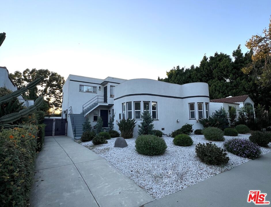 Residential Income for sale at 853 N Mansfield Avenue, Los Angeles CA featuring 4 beds and 4 baths