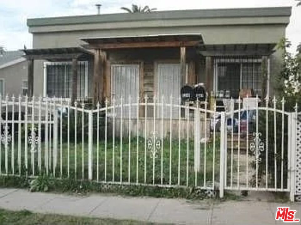 Residential Income for sale at 1241 S Muirfield Road, Los Angeles CA featuring 4 beds and 3 baths