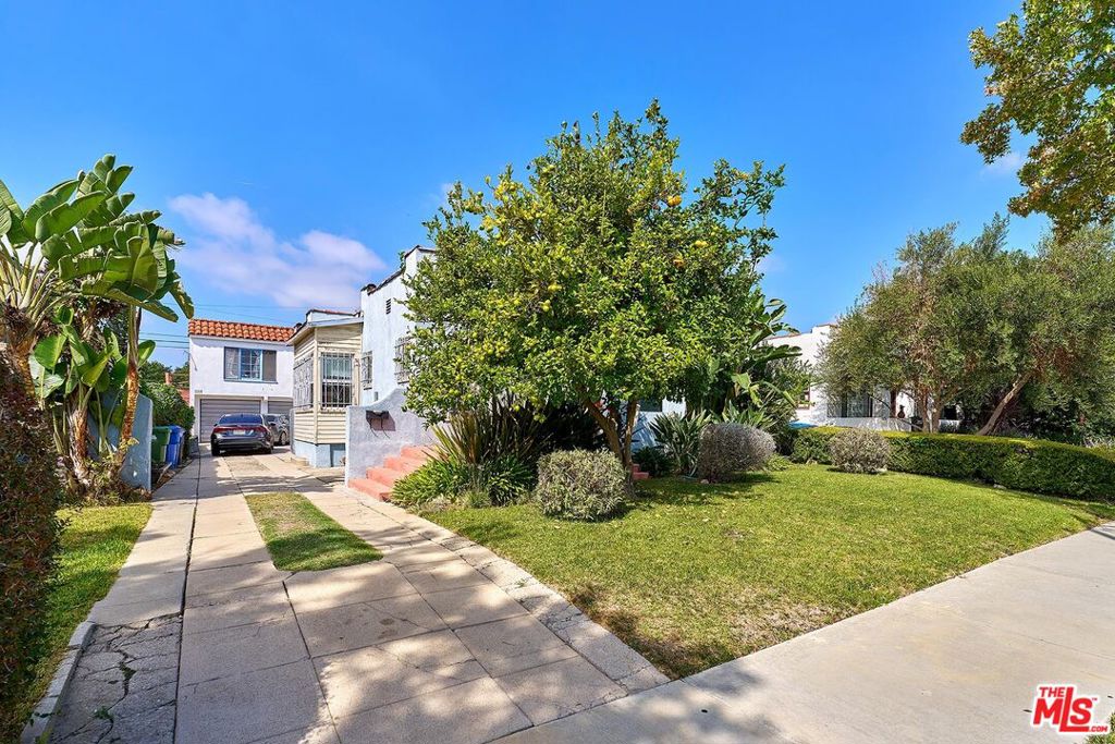 Residential Income for sale at 2115 S Mansfield Avenue, Los Angeles CA featuring 4 beds and 2 baths