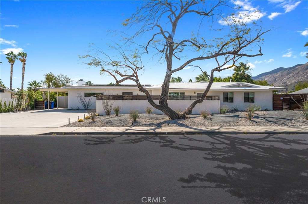 Residential for sale at 1055 E Racquet Club, Palm Springs CA featuring 4 beds and 4 baths