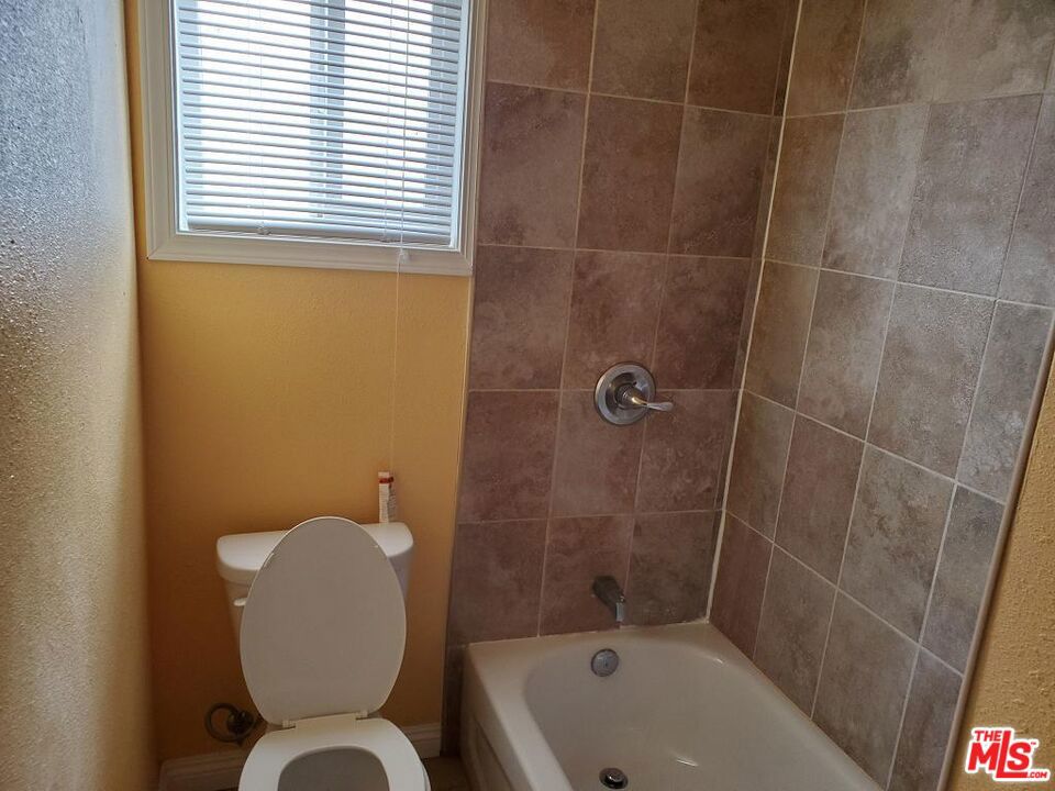 Residential Income for sale at 251 W 41st Place, Los Angeles CA featuring 11 beds and 7 baths
