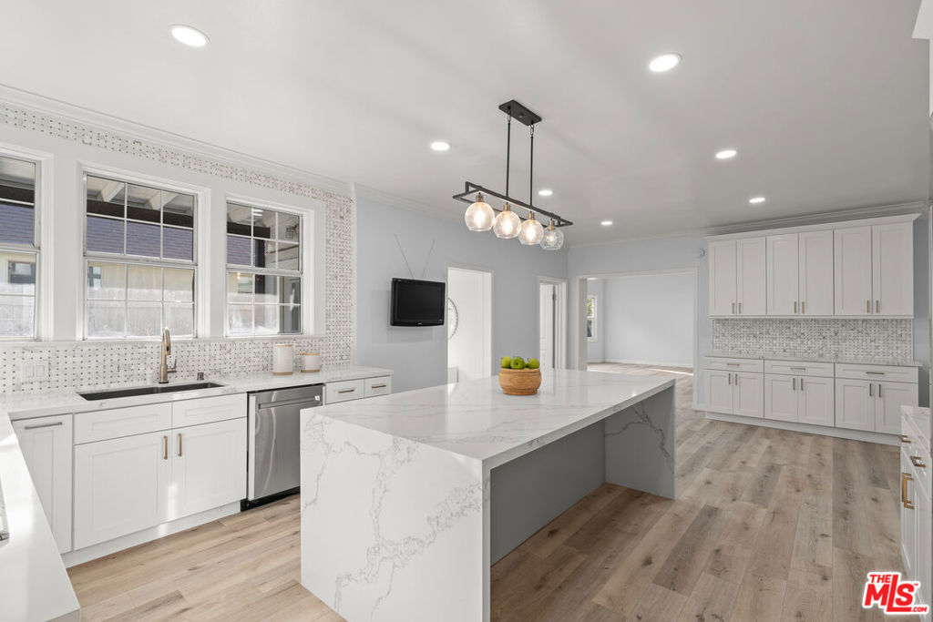 Residential for sale at 1250 S Windsor Boulevard, Los Angeles CA featuring 7 beds and 9 baths