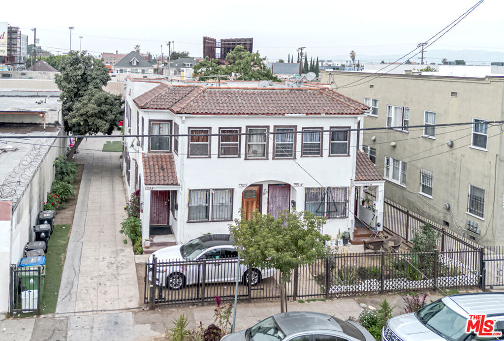 Residential Income for sale at 1521 Menlo Avenue, Los Angeles CA featuring 6 beds and 4 baths