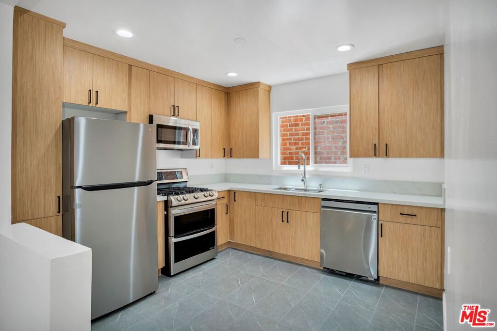 Residential Income for sale at 5614 W Adams Boulevard, Los Angeles CA featuring 14 beds and 7 baths