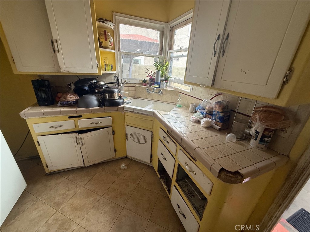 Residential for sale at 4909 E 59th, Maywood CA featuring 2 beds and 1 bath