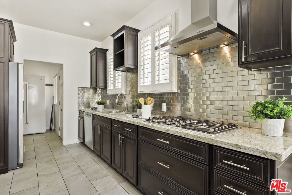 Residential for sale at 5761 W Olympic Boulevard, Los Angeles CA featuring 4 beds and 4 baths