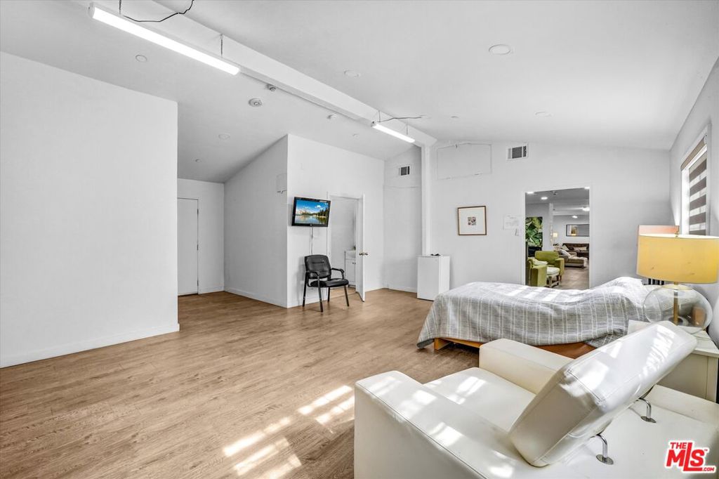 Single Family Residence for sale at 4669 W Olympic Boulevard, Los Angeles, CA featuring 6 beds and 4 baths