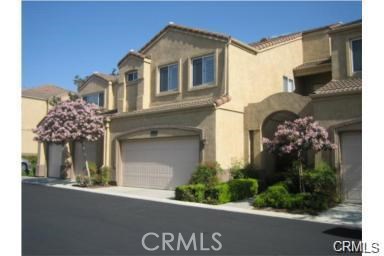 Townhouse for rent at 2130 Almeria Street 102, Corona, CA featuring 2 beds and 3 baths