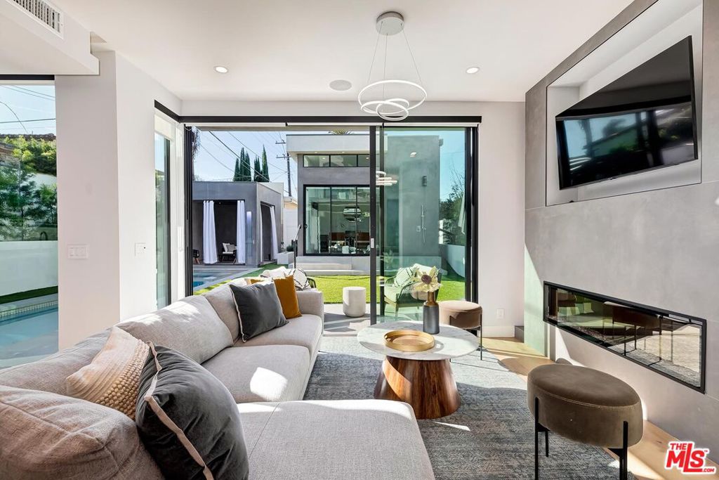 Residential for sale at 489 S Willaman Drive, Los Angeles CA featuring 6 beds and 7 baths