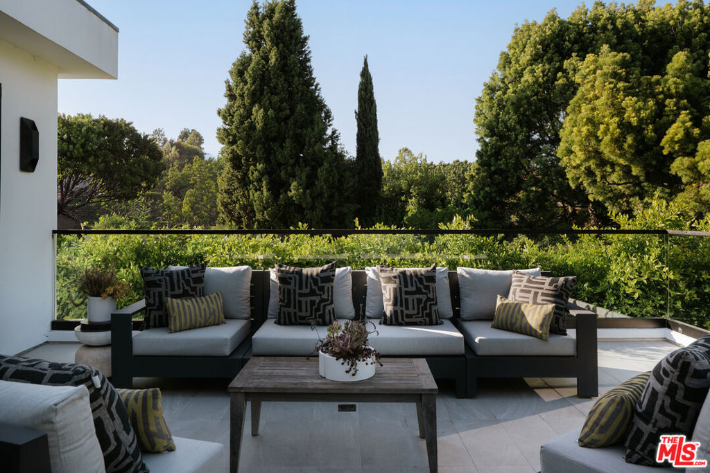 Residential for sale at 144 N Bowling Green Way, Los Angeles CA featuring 5 beds and 8 baths
