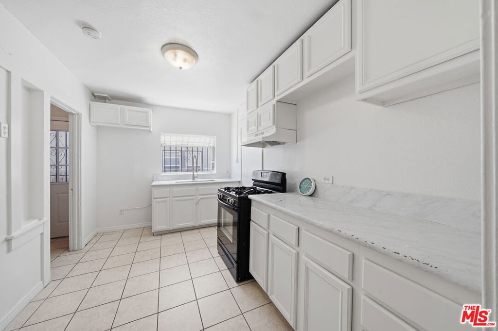 Residential Income for sale at 936 S Lucerne Boulevard, Los Angeles, CA featuring 2 beds and 2 baths
