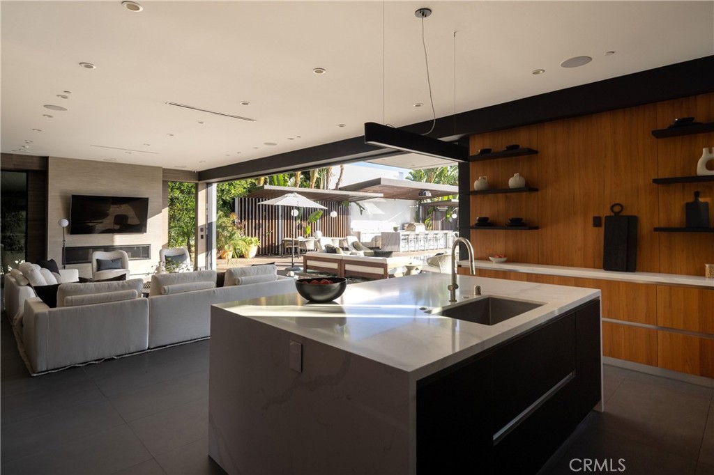 Single Family Residence for sale at 7107 Macapa Drive, Los Angeles, CA featuring 6 beds and 9 baths