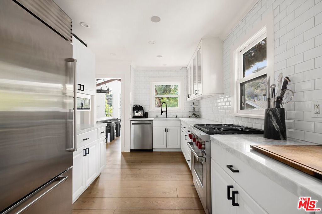 Single Family Residence for sale at 8061 Woodland Lane, Los Angeles, CA featuring 3 beds and 2 baths