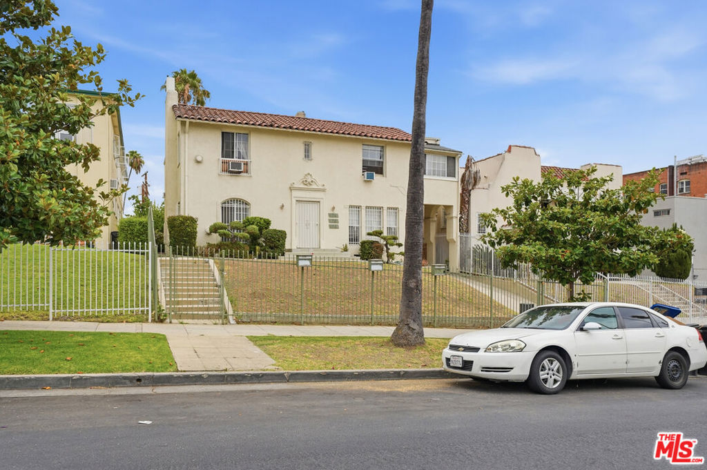 Residential Income for sale at 124 N Berendo Street, Los Angeles, CA featuring 7 beds and 4 baths