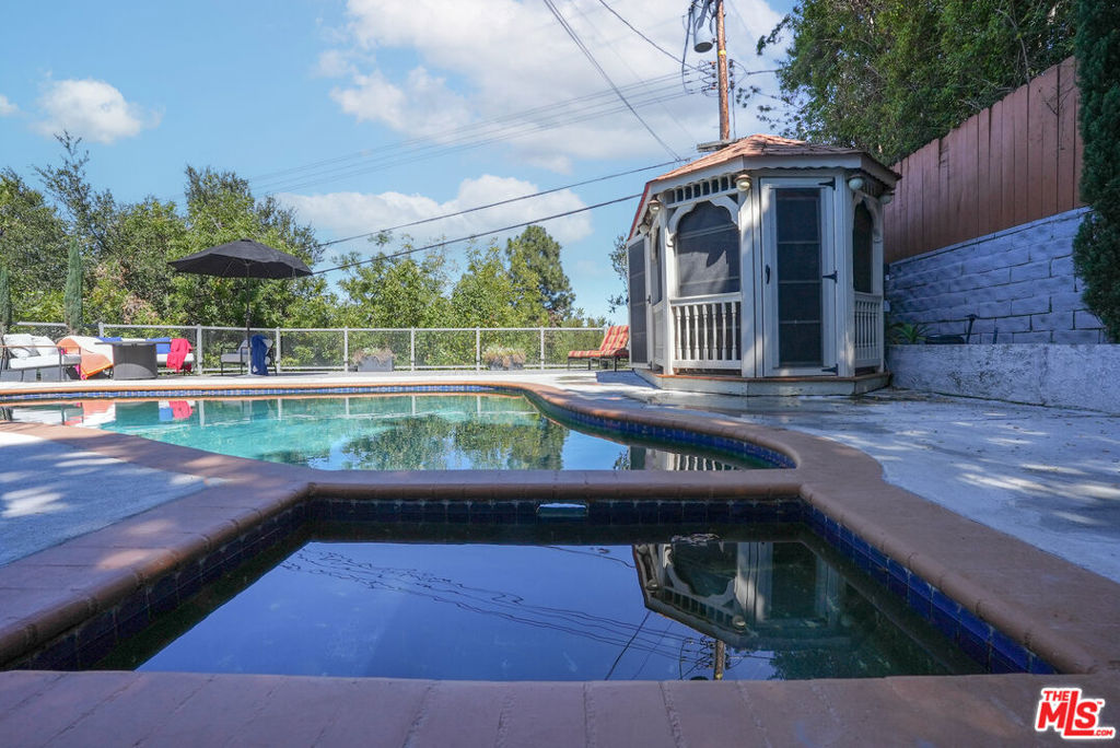 Single Family Residence for sale at 7796 Skyhill Drive, Los Angeles, CA featuring 5 beds and 4 baths
