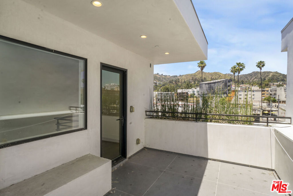 Townhouse for sale at 1445 1/4 N Martel Avenue, Los Angeles, CA featuring 3 beds and 3 baths