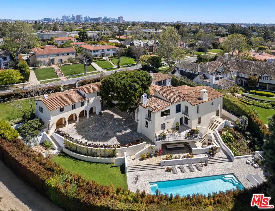 Single Family Residence for sale at 211 S Muirfield Road, Los Angeles, CA featuring 8 beds and 12 baths