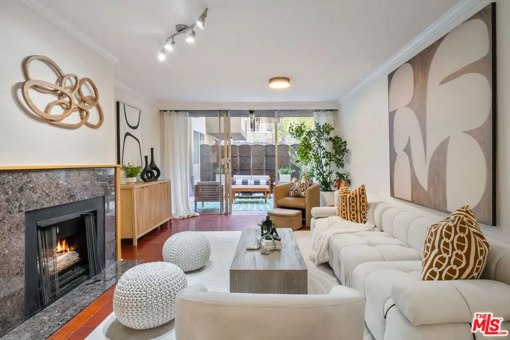 Condominium for sale at 1745 Camino Palmero Street 104, Los Angeles, CA featuring 2 beds and 2 baths