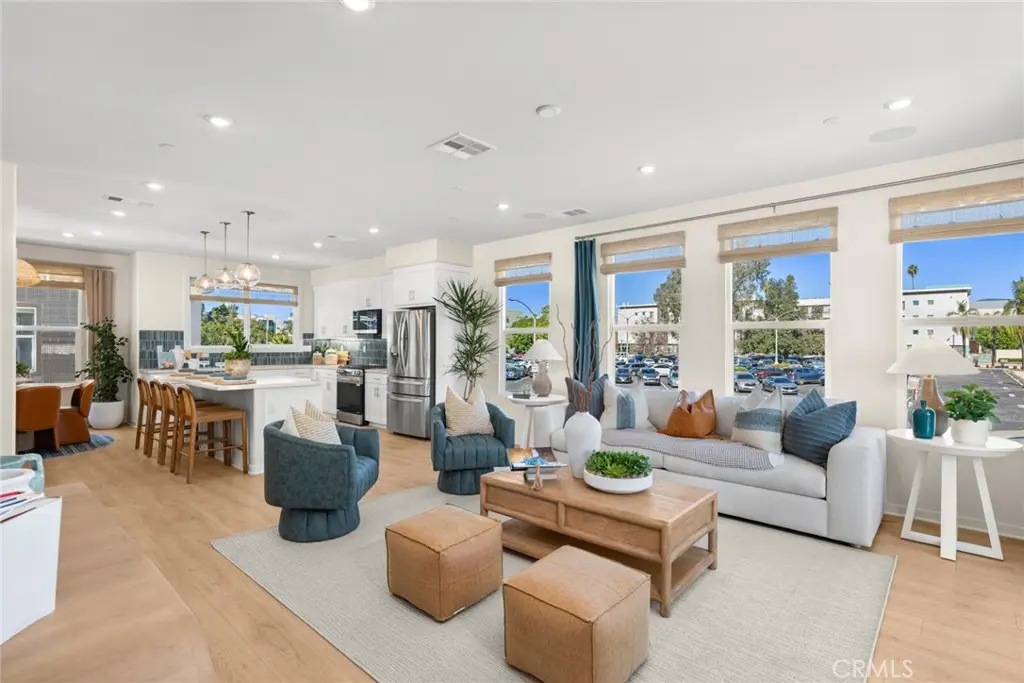 Townhouse for sale at 445 S Eleanor Street, Pomona, CA featuring 4 beds and 3 baths