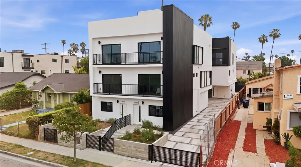 Townhouse for sale at 1428 S Cloverdale Avenue 1/2, Los Angeles, CA featuring 4 beds and 4 baths
