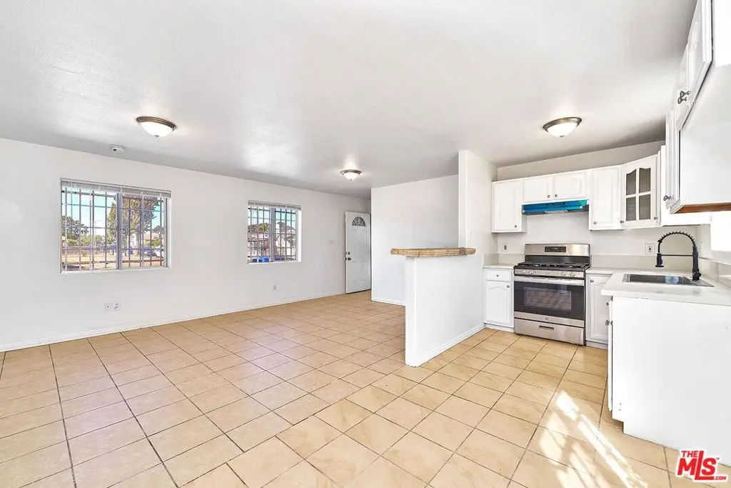 Residential Income for sale at 10800 S San Pedro Street, Los Angeles, CA featuring 6 beds and 4 baths