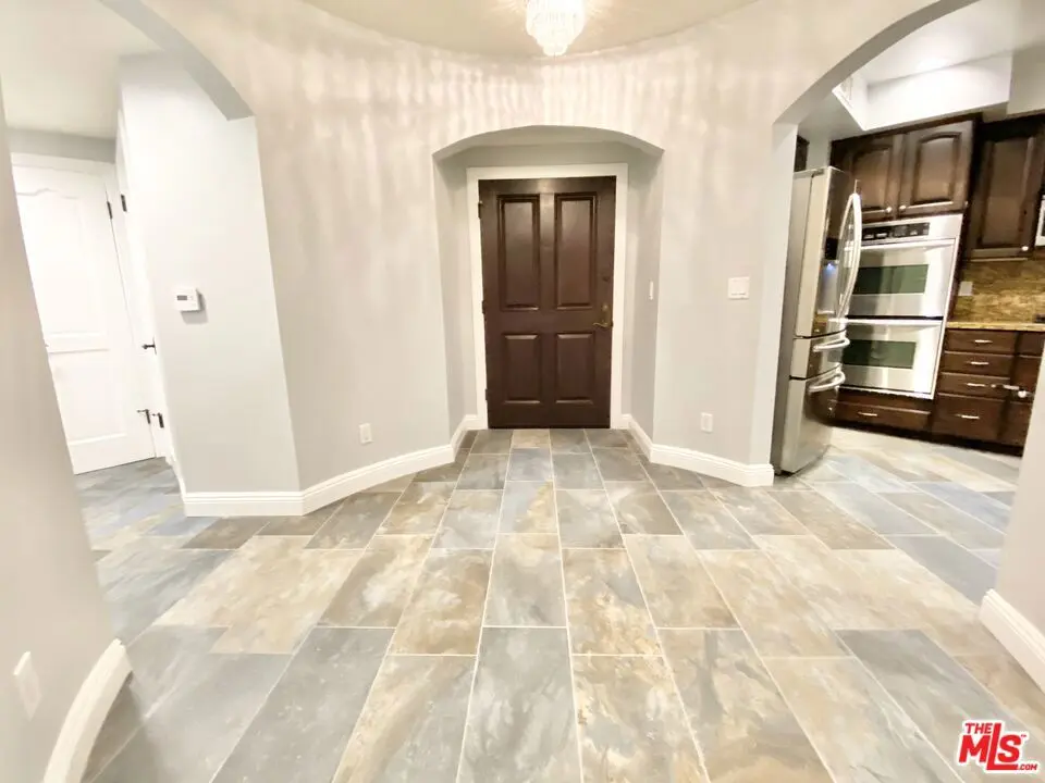 Condominium for rent at 1135 Rexford Dr 102, Los Angeles, CA featuring 3 beds and 3 baths