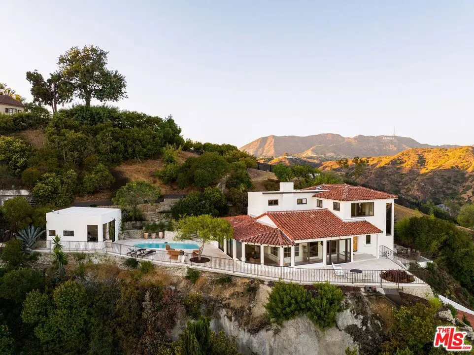 Single Family Residence for sale at 6911 Los Tilos Road, Los Angeles, CA featuring 4 beds and 5 baths