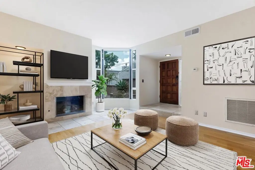 Townhouse for sale at 1717 Stoner Avenue 105, Los Angeles, CA featuring 2 beds and 3 baths