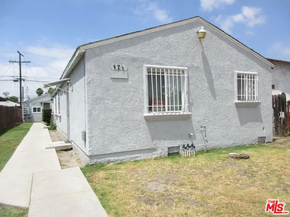 Residential Income for sale at 427 E 98th Street, Los Angeles, CA featuring 7 beds and 3 baths