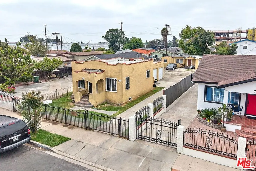 Residential Income for sale at 718 E 110th Street, Los Angeles, CA featuring 4 beds and 2 baths