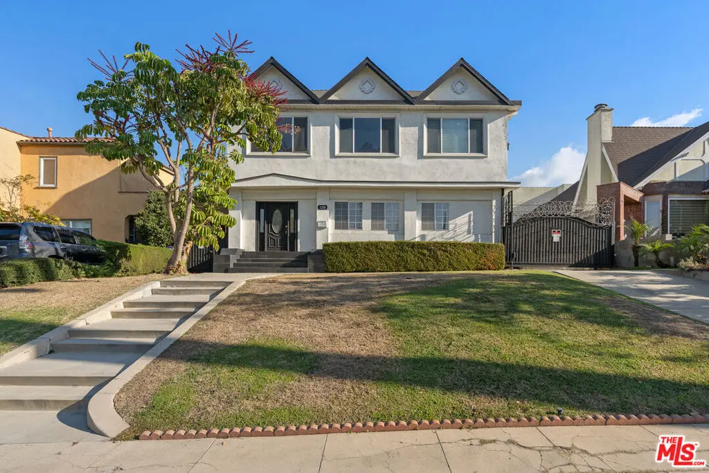 Single Family Residence for sale at 1250 S Windsor Boulevard, Los Angeles, CA featuring 7 beds and 9 baths