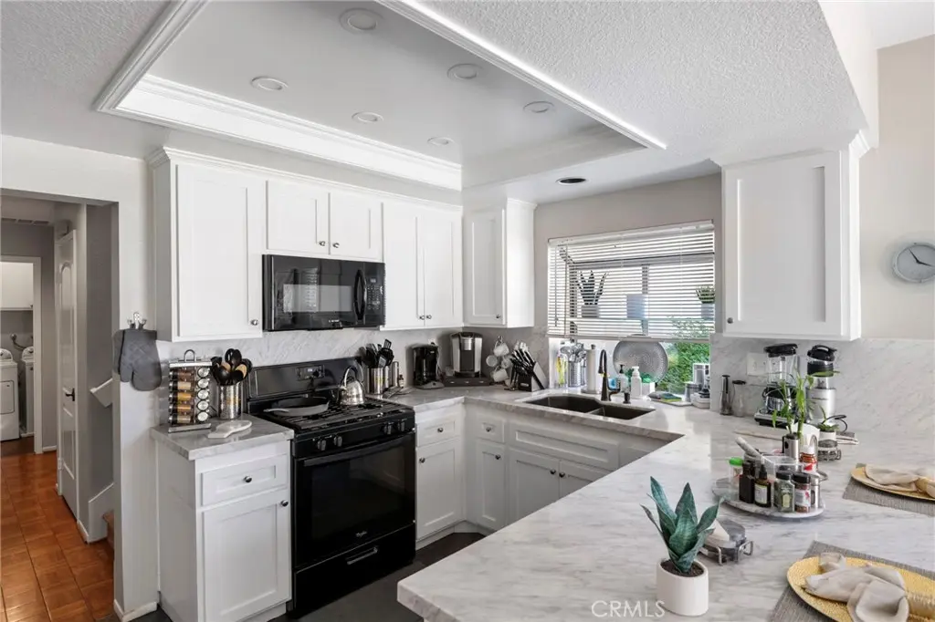 Condominium for sale at 2410 Mira Monte Court, Tustin, CA featuring 3 beds and 3 baths
