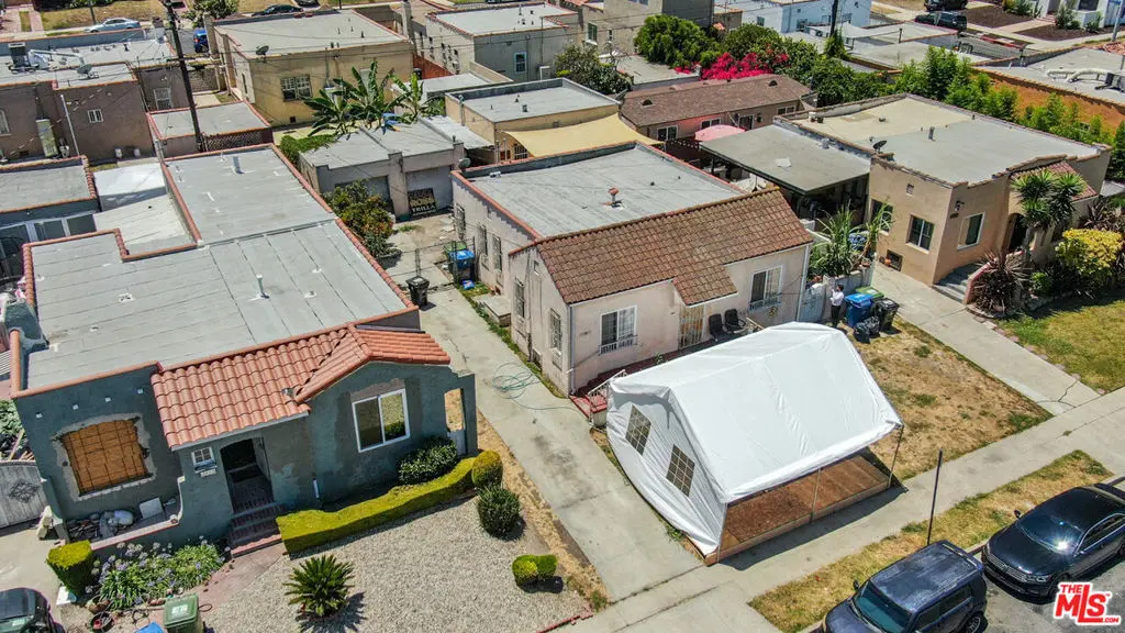 Residential Income for sale at 2056 W 67th Street, Los Angeles, CA featuring 4 beds and 2 baths