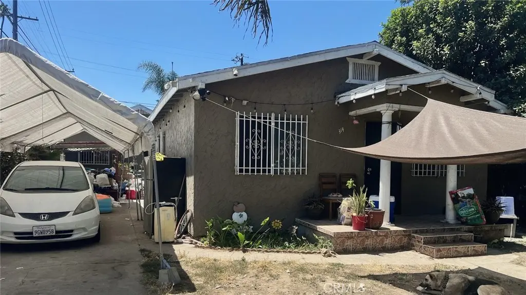 Duplex for sale at 314 W 66th, Los Angeles, CA featuring 4 beds and 2 baths