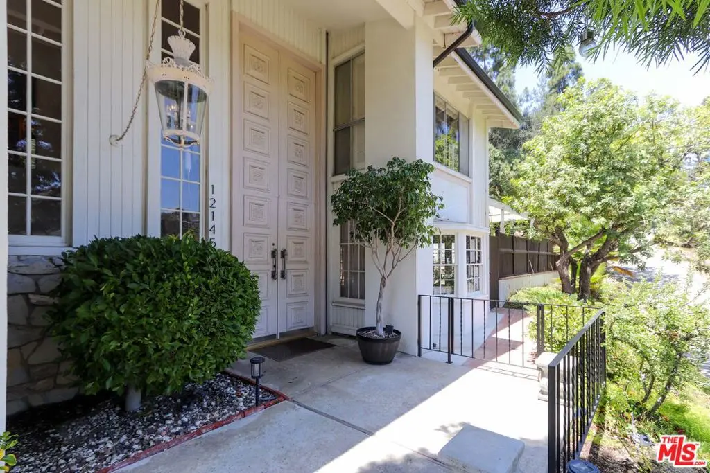 Single Family Residence for sale at 12145 La Casa Lane, Los Angeles, CA featuring 5 beds and 4 baths