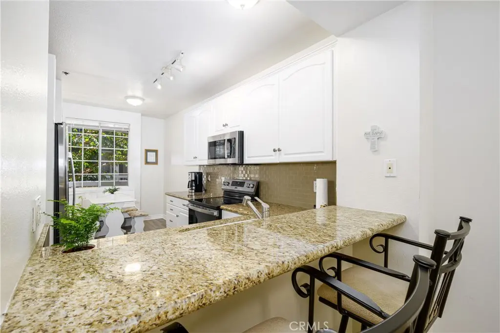Condominium for sale at 20301 Bluffside Circle 211, Huntington Beach, CA featuring 2 beds and 2 baths