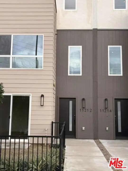 Townhouse for sale at 11212 W Victory Boulevard 7, Los Angeles, CA featuring 3 beds and 4 baths
