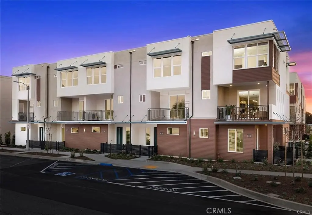 Townhouse for sale at 445 S Eleanor Street, Pomona, CA featuring 4 beds and 3 baths