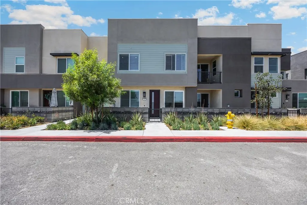 Townhouse for sale at 3681 E Jacobson Paseo 9, Ontario, CA featuring 2 beds and 3 baths