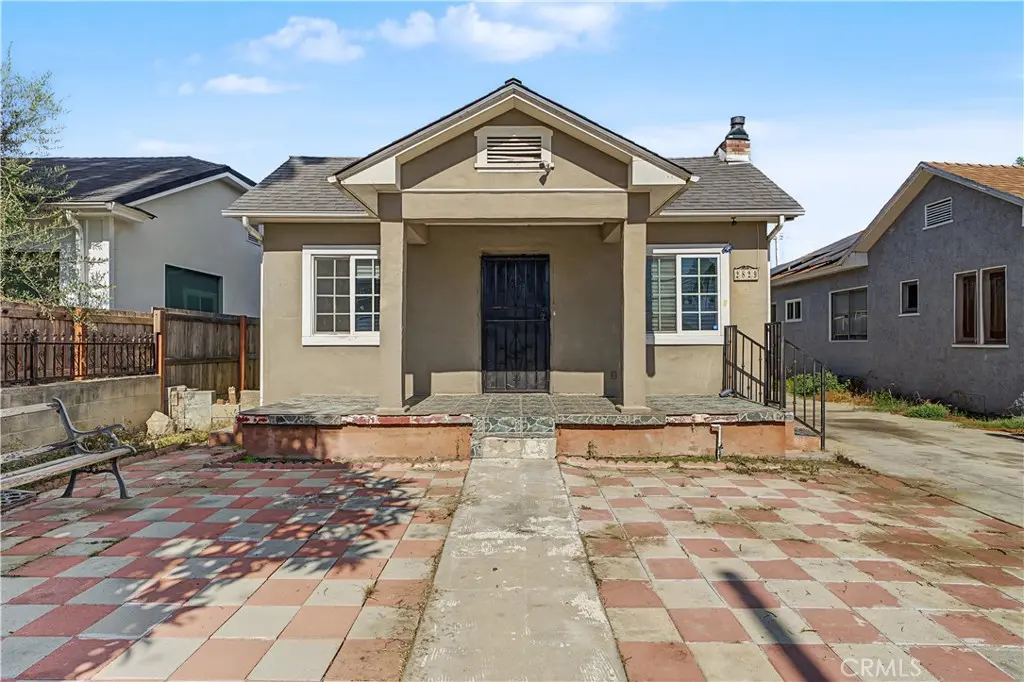 Duplex for sale at 2829 S Rimpau, Los Angeles, CA featuring 5 beds and 2 baths