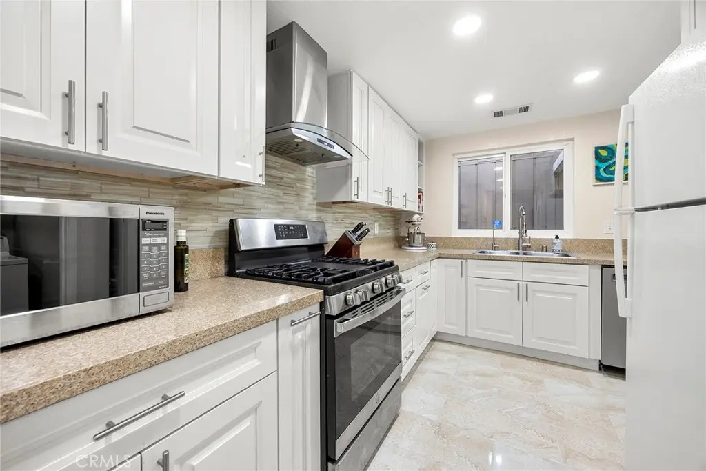 Townhouse for sale at 2369 S Reservoir, Pomona, CA featuring 2 beds and 2 baths