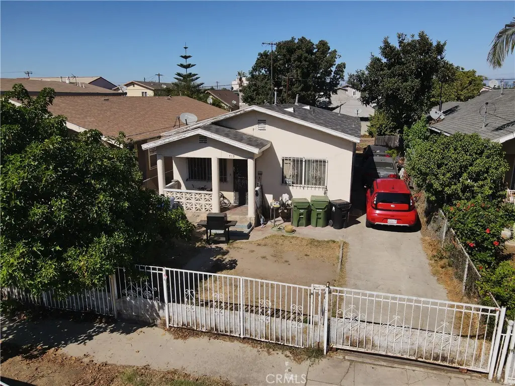 Single Family Residence for sale at 715 W 56th Street, Los Angeles, CA featuring 4 beds and 2 baths